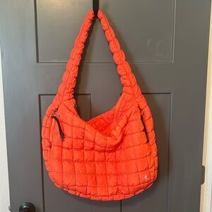 Free People quilted carryall bag in a pretty red/orange color.